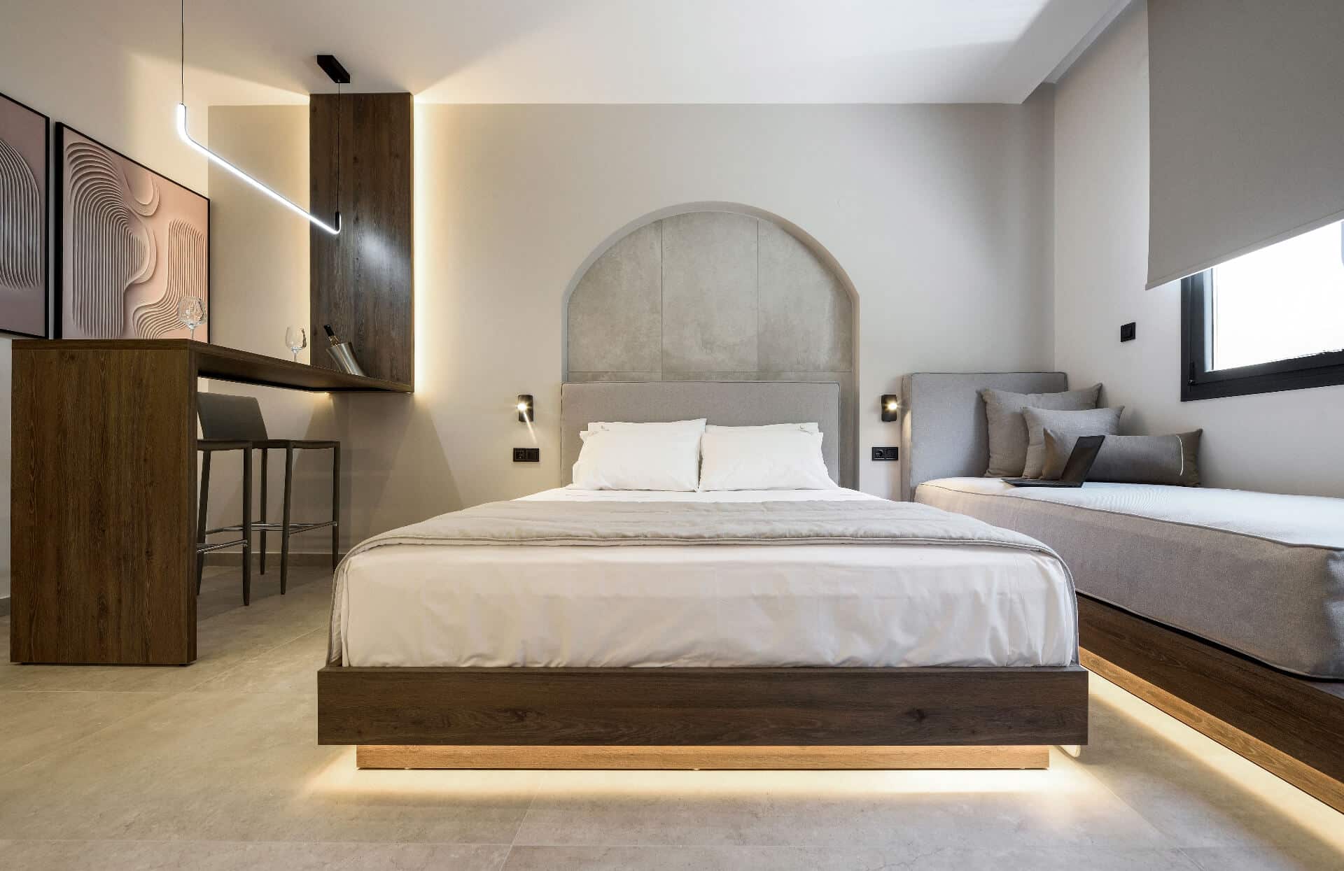 The suite's queen-size bed and extra single, with the daybed by the window